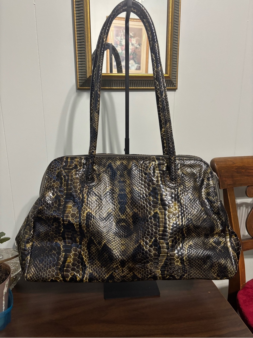 a vintage Danier python-embossed leather satchel bag